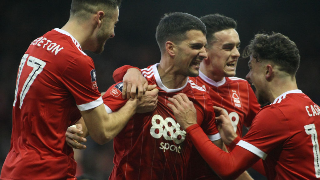 Eric Lichaj celebrates with team mates after giving Forest the lead  during The Emirates FA Cup Third Round match between Nottingham Forest and Ars...