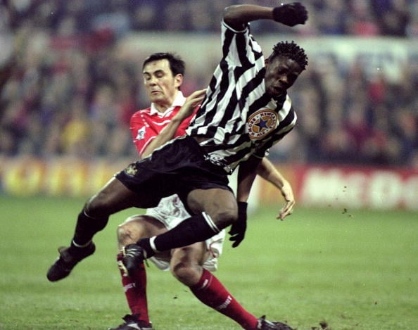 10 Mar 1999:  Louis Saha of Newcastle United is tackled by Steve Chettle of Nottingham Forest during the FA Carling Premiership match against Notti...