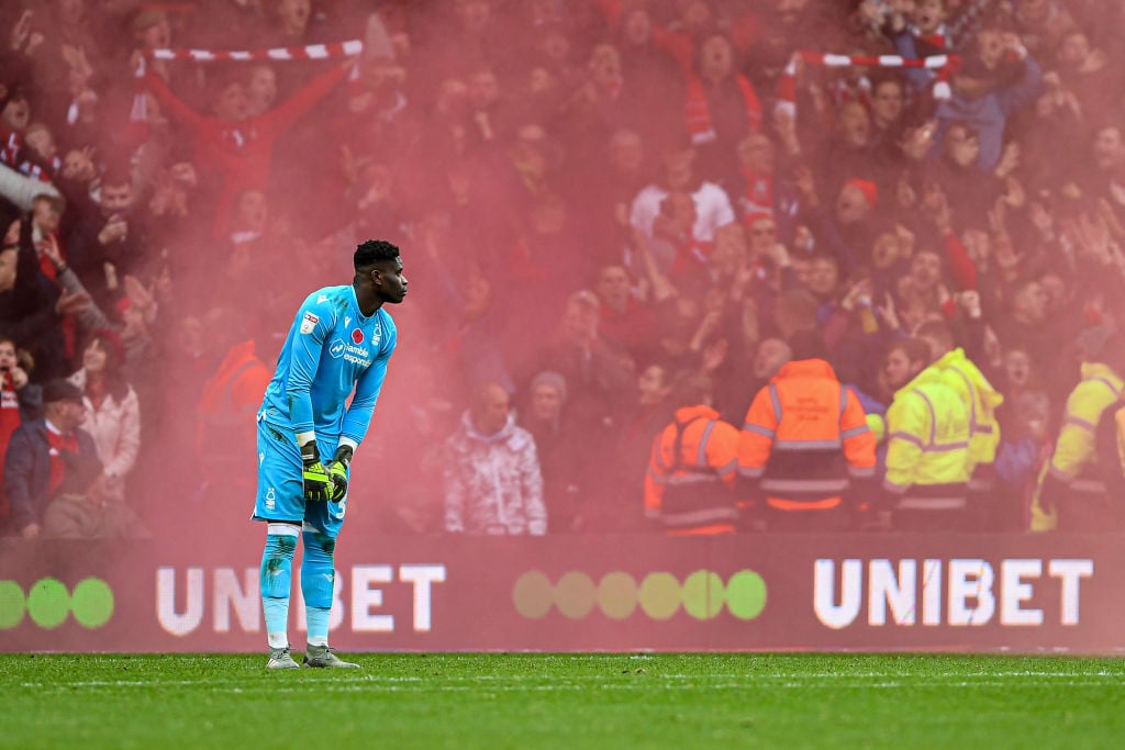 Brice Samba (30) of Nottingham Forest with a reds make flare during the Sky Bet Championship match between Nottingham Forest and Derby County at th...