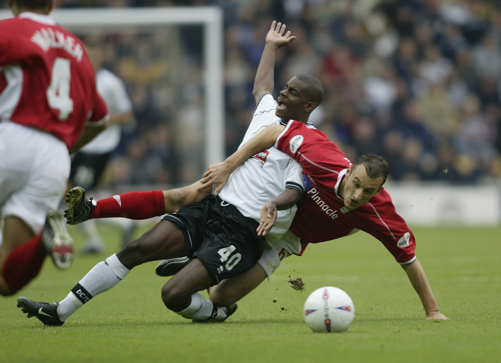 DERBY - OCTOBER 20: Izale McLeod of Derby County and Riccardo Scimeca of Nottingham Forest in actio