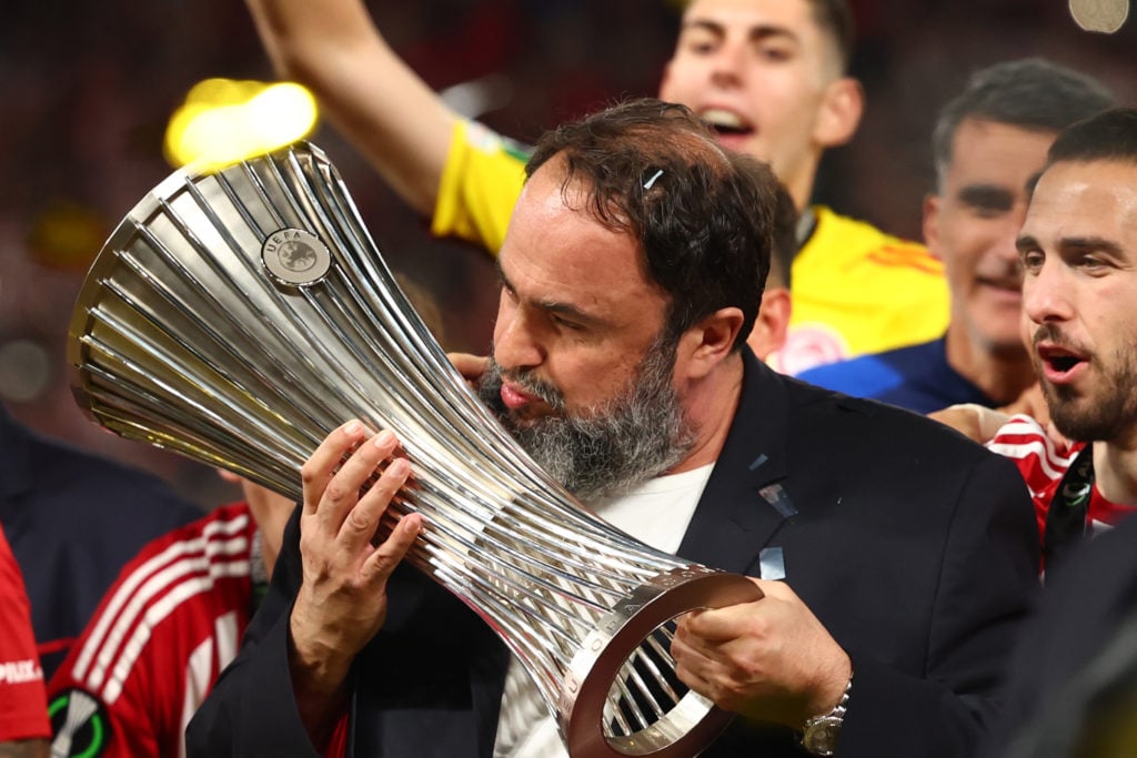 Evangelos Marinakis celebrates with the UEFA Conference League trophy after Olympiacos beat ACF Fiorentina in the 2023/24 final