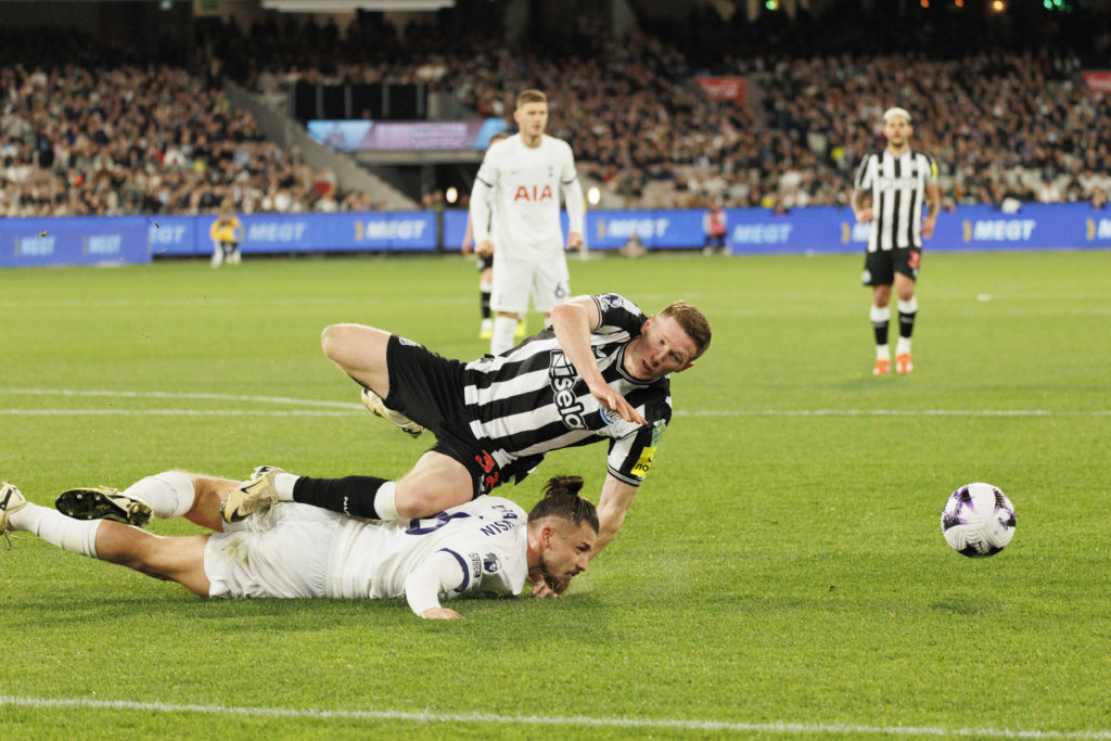 Elliot Anderson of Newcastle United FC and Radu Drguin