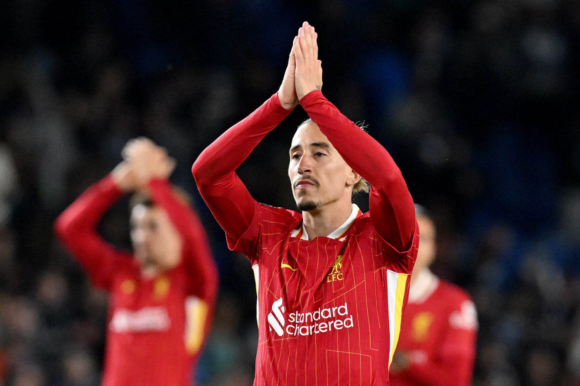 Liverpool defender Kostas Tsimikas acknowledges Liverpool fans.