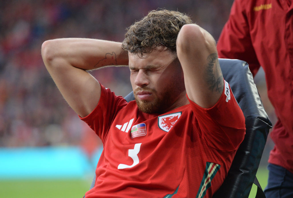 Neco Williams is carried off injured during the FIFA World Cup 2026 European Qualifier between Wales and Liechtenstein