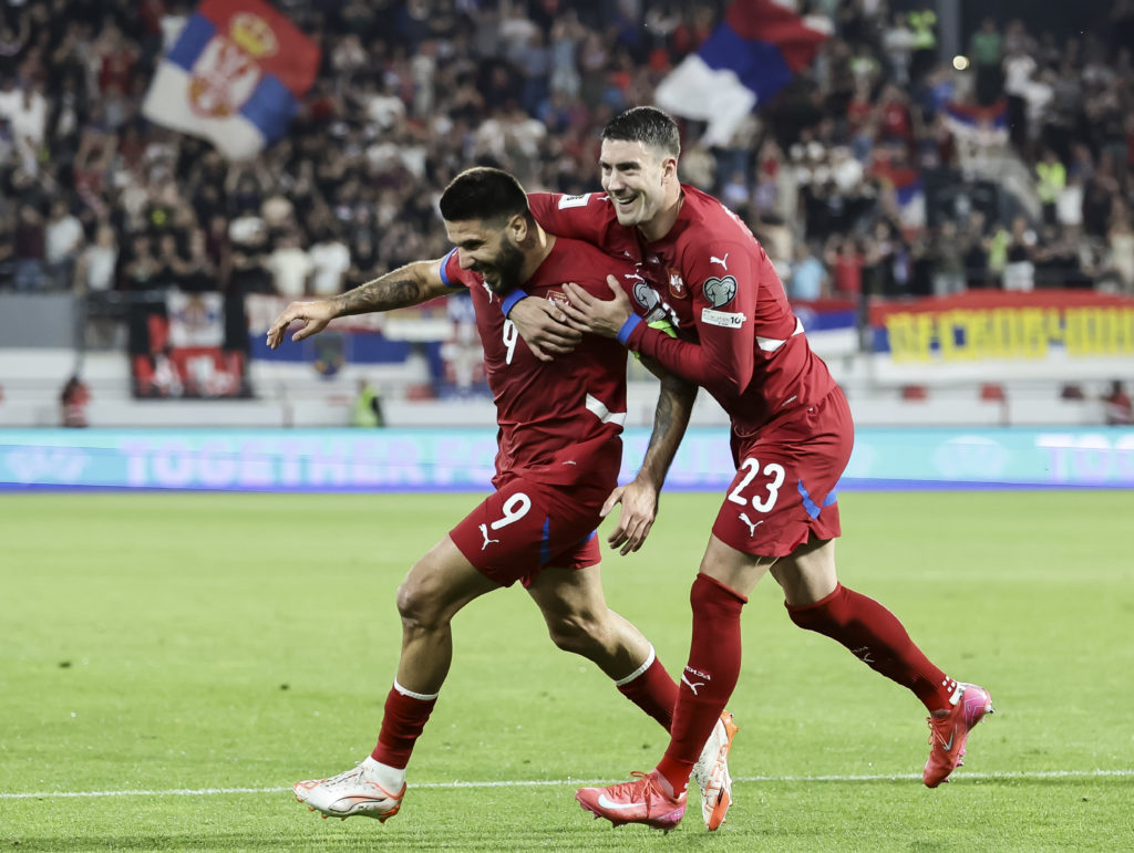 Aleksandar Mitrovic (L) of Serbia celebrates after scoring a goal with Dusan Vlahovic (R)
