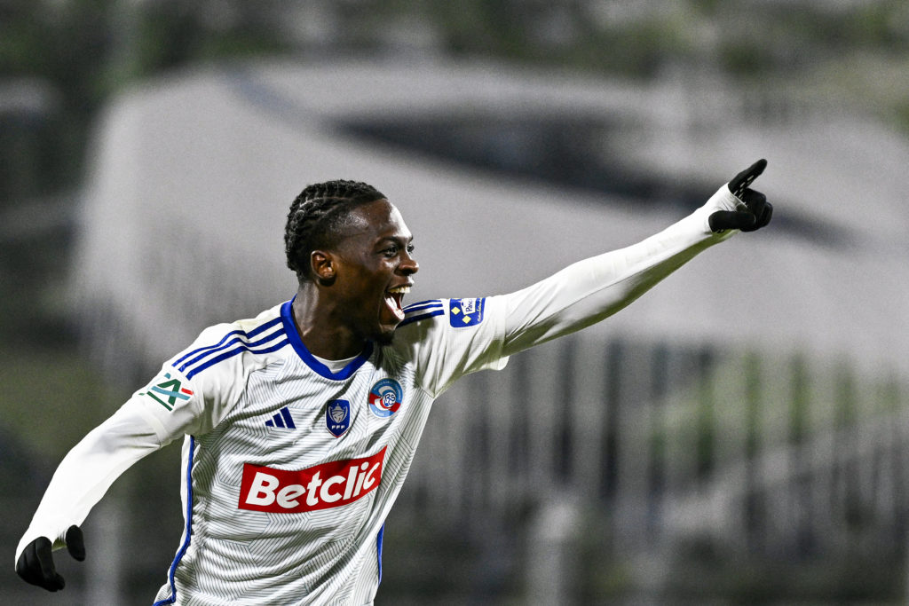 Dilane Bakwa celebrates scoring for Strasbourg against Clermont Foot.