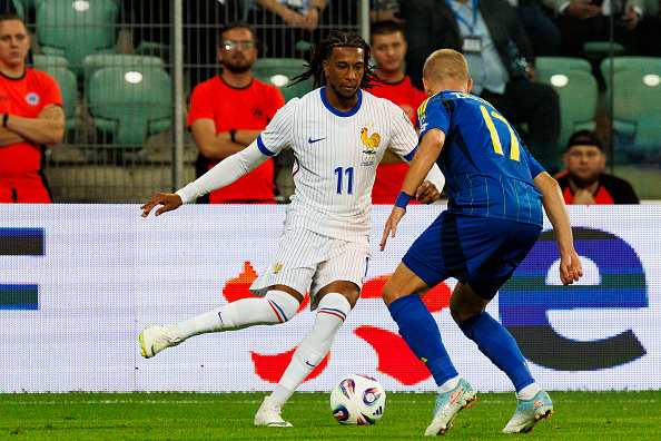 Zinchenko defending against Michael Olise for Ukraine