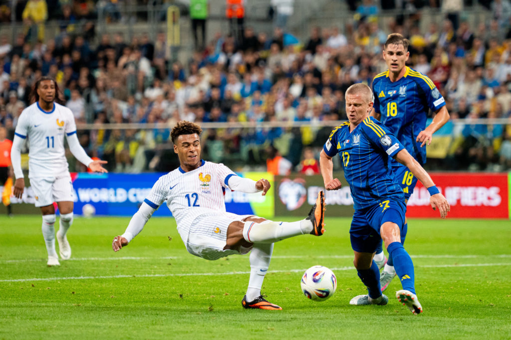 Oleksandr ZInchenko in action for Ukraine against Desire Doue