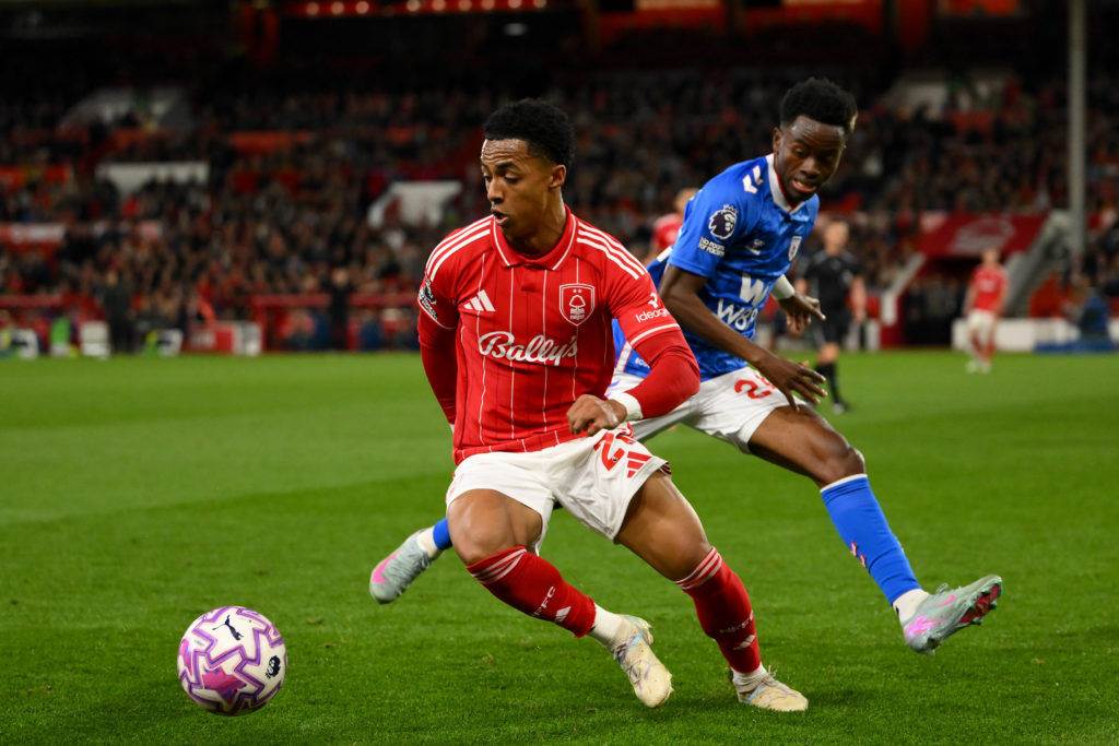 Omari Hutchinson of Nottingham Forest is under pressure from Simon Adingra of Sunderland